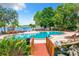 Enjoy this community pool and waterfront views with plenty of lounge chairs for relaxing at 1111 Salerno Ct # Ge, Orlando, FL 32806