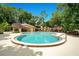 Community swimming pool featuring ample space for lounging and a shaded pergola at 1111 Salerno Ct # Ge, Orlando, FL 32806