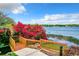 Scenic water view showing mature landscaping and water access perfect for relaxing and enjoying the view at 1111 Salerno Ct # Ge, Orlando, FL 32806