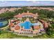 Stunning aerial view showcasing a community pool, sundeck, and beautifully landscaped common areas at 1120 Parma Cir, Lake Mary, FL 32746