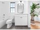 Clean, modern bathroom with tile flooring, a single sink vanity, and natural light from the window at 1120 Parma Cir, Lake Mary, FL 32746