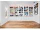Library room with a large, built-in bookcase with storage and hardwood floors at 1120 Parma Cir, Lake Mary, FL 32746