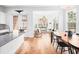 Inviting space combining dining and living areas, with large windows and stylish decor elements at 1120 Parma Cir, Lake Mary, FL 32746