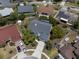 Aerial view highlights home location on cul-de-sac, screened pool, and mature landscaping adding charm to the property at 11705 Binfield Ct, Orlando, FL 32837