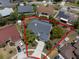 The Aerial View shows the property outline of home with screened pool, landscaping and cul-de-sac location at 11705 Binfield Ct, Orlando, FL 32837