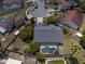 Aerial view of the property showing a screened pool, fenced yard, and mature trees on a quiet cul-de-sac street at 11705 Binfield Ct, Orlando, FL 32837