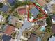 Aerial view showcasing a home with a pool, highlighted within a cul-de-sac at 11705 Binfield Ct, Orlando, FL 32837