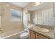 Standard bathroom features a bath tub, toilet, and vanity with a granite countertop at 11705 Binfield Ct, Orlando, FL 32837