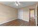 Neutral bedroom features hardwood floors and a double door closet at 11705 Binfield Ct, Orlando, FL 32837