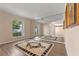 Versatile bonus room with wood floors, large windows, and mirrored wall at 11705 Binfield Ct, Orlando, FL 32837