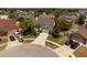 Aerial shot displays the home's position, mature trees, and proximity to neighborhood amenities with circle driveway at 11705 Binfield Ct, Orlando, FL 32837
