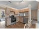 Kitchen with stainless steel appliances, granite counters, and plenty of cabinet space at 11705 Binfield Ct, Orlando, FL 32837