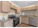 Kitchen featuring stainless steel appliances, granite counters, and wood cabinets at 11705 Binfield Ct, Orlando, FL 32837