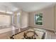 Bright living room featuring wood floors, a large window, and an open floor plan at 11705 Binfield Ct, Orlando, FL 32837