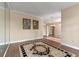 Bright living room featuring wood floors, a large area rug, and an open floor plan at 11705 Binfield Ct, Orlando, FL 32837