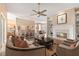 Open-concept living area with a fireplace, hardwood floors, and plenty of natural light at 11705 Binfield Ct, Orlando, FL 32837