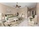 Relaxing main bedroom featuring plush carpet, a ceiling fan, and neutral paint at 11705 Binfield Ct, Orlando, FL 32837