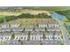 A high aerial view showcases the beautiful neighborhood, green spaces, and community amenities at 12079 Scrub Palm Ln, Orlando, FL 32824