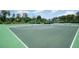 Community basketball court with hoops, benches, and well-maintained surface for recreational play at 12079 Scrub Palm Ln, Orlando, FL 32824