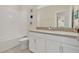 Clean and modern bathroom with a shower and tub combination, white vanity, and decorative accents at 12079 Scrub Palm Ln, Orlando, FL 32824