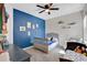 Cozy bedroom with a charming crib and playful decor, creating a warm and inviting space at 12079 Scrub Palm Ln, Orlando, FL 32824
