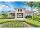 The neighborhood clubhouse features manicured landscaping, a welcoming entrance, and neutral paint colors at 12079 Scrub Palm Ln, Orlando, FL 32824