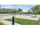 Bright community pool with lounge chairs and splash pad features, perfect for relaxation and fun at 12079 Scrub Palm Ln, Orlando, FL 32824