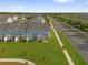Aerial view of townhouses highlights backyard green spaces at 1341 Wycliffe Way, St Cloud, FL 34771