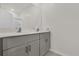Bathroom featuring double vanity with gray cabinets and a large mirror at 1341 Wycliffe Way, St Cloud, FL 34771