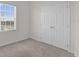 Bedroom featuring a window and double doors at 1341 Wycliffe Way, St Cloud, FL 34771