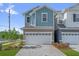 Charming two-story townhome with a large garage and beautiful brick driveway at 1341 Wycliffe Way, St Cloud, FL 34771