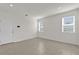 Bright living room with neutral walls and tile floors, illuminated by recessed lighting and natural light from windows at 1341 Wycliffe Way, St Cloud, FL 34771