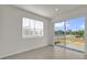 Bright living room features a sliding glass door offering seamless access to the outdoor space at 1341 Wycliffe Way, St Cloud, FL 34771