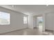 Bright living room with neutral paint, tile floors, recessed lights and natural light from two windows at 1341 Wycliffe Way, St Cloud, FL 34771