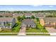 Aerial view of the single-Gathering home featuring a manicured lawn, landscaping and paved driveway at 14517 Black Lake Preserve St, Winter Garden, FL 34787