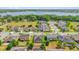 Community aerial view of beautiful homes with well-kept lawns near a lake, showcasing a desirable neighborhood at 14517 Black Lake Preserve St, Winter Garden, FL 34787