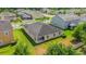 The backyard featuring a covered patio and a well-manicured lawn at 14517 Black Lake Preserve St, Winter Garden, FL 34787