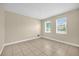 Bedroom with tile flooring and two bright windows that let in plenty of natural light at 14517 Black Lake Preserve St, Winter Garden, FL 34787