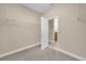 Walk-in closet with carpeted floors, white wire shelving and a window for natural light at 14517 Black Lake Preserve St, Winter Garden, FL 34787