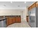 Open-concept kitchen with stainless steel appliances and granite countertops, perfect for modern living at 14517 Black Lake Preserve St, Winter Garden, FL 34787