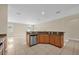 Bright kitchen features granite countertops, stainless steel appliances, and an open design to the living area at 14517 Black Lake Preserve St, Winter Garden, FL 34787