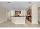 Spacious kitchen with modern appliances, a breakfast bar, and ample counter space at 14517 Black Lake Preserve St, Winter Garden, FL 34787