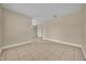 Living room with tile floors, base trim and neutral colored walls at 14517 Black Lake Preserve St, Winter Garden, FL 34787