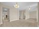 Spacious living room featuring tile flooring and neutral paint tones at 14517 Black Lake Preserve St, Winter Garden, FL 34787