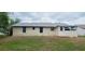 Rear view of a single-story home, showing the back of the property at 1472 6Th Ave, Deland, FL 32724