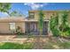 Relaxing screened patio with lush backyard, ideal for outdoor enjoyment and privacy at 1523 Casa Park Cir, Winter Springs, FL 32708