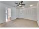 Large bedroom with double closets, ceiling fan, and connected bathroom at 1523 Casa Park Cir, Winter Springs, FL 32708