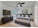 Stylish bedroom with modern furniture, decor, and a ceiling fan at 1523 Casa Park Cir, Winter Springs, FL 32708