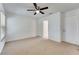 Bedroom offers ample space, neutral carpet, and a ceiling fan at 1523 Casa Park Cir, Winter Springs, FL 32708