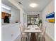 Elegant dining room with a marble-top table and a view of the outdoor area at 1523 Casa Park Cir, Winter Springs, FL 32708
